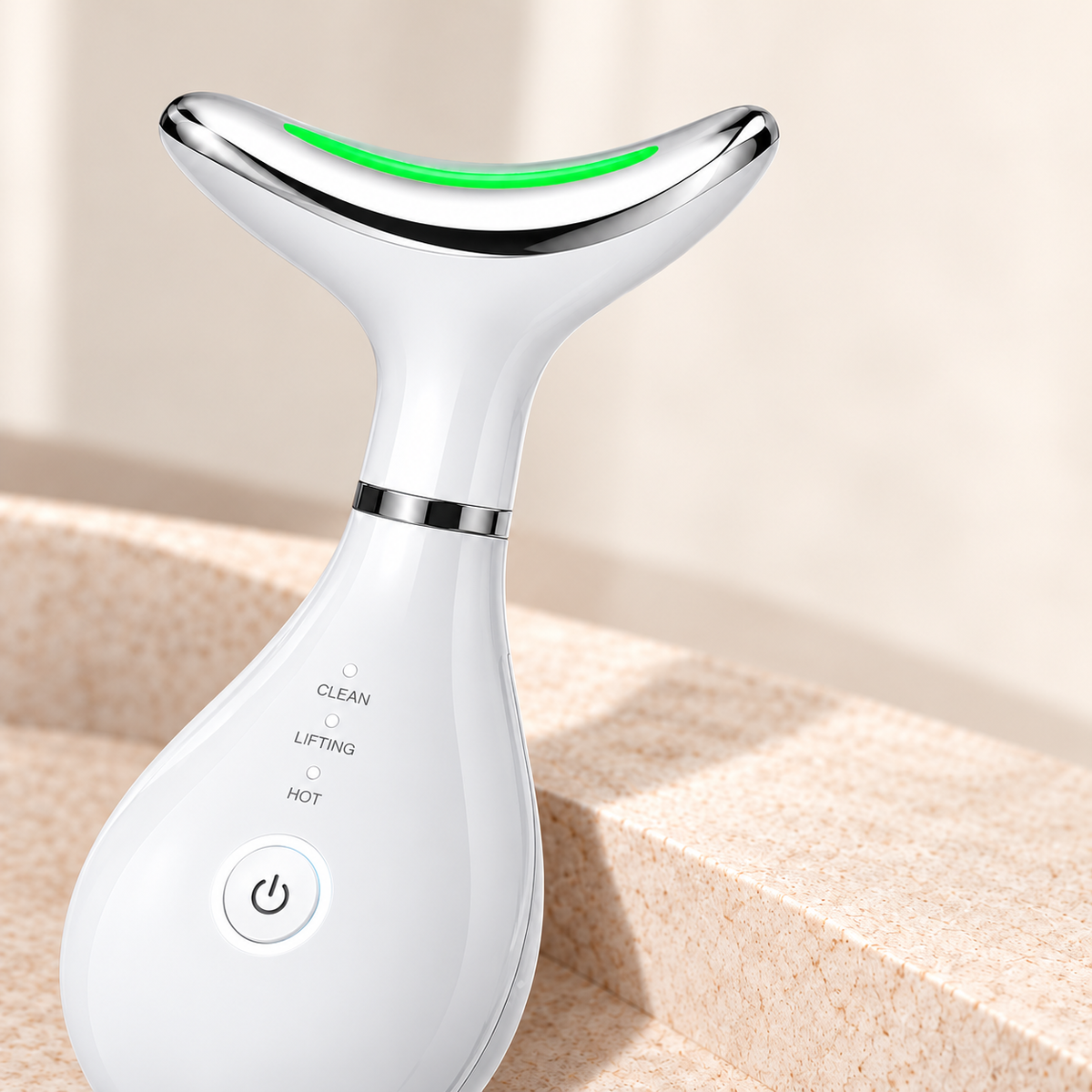 Close-up of the white beauty wand treatment head, silver sensor ring and physical controls.